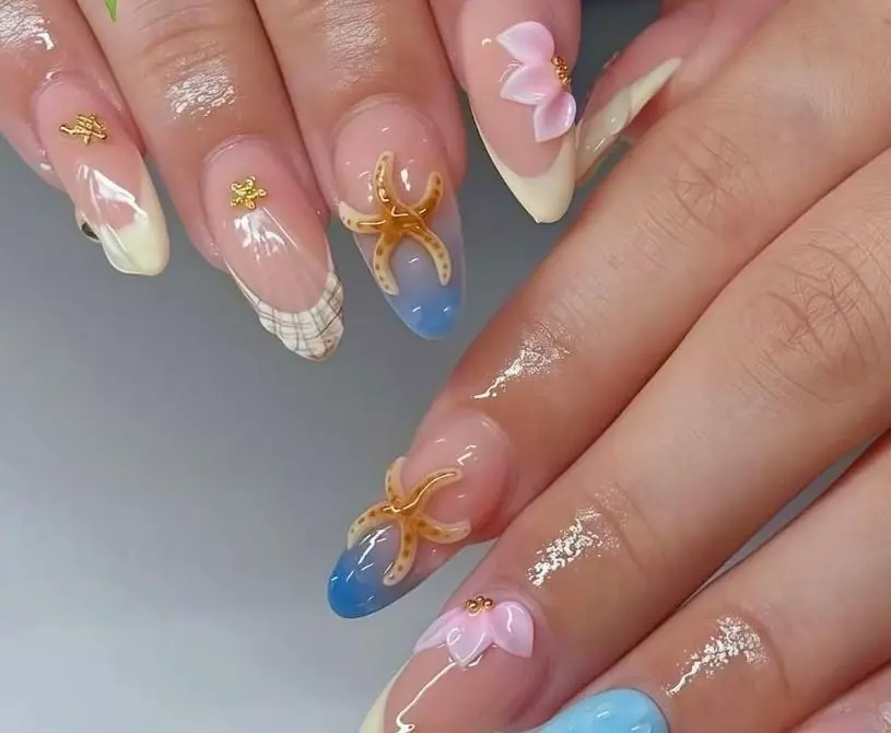 A different design on every nail, with pastels, starfish and 3D details